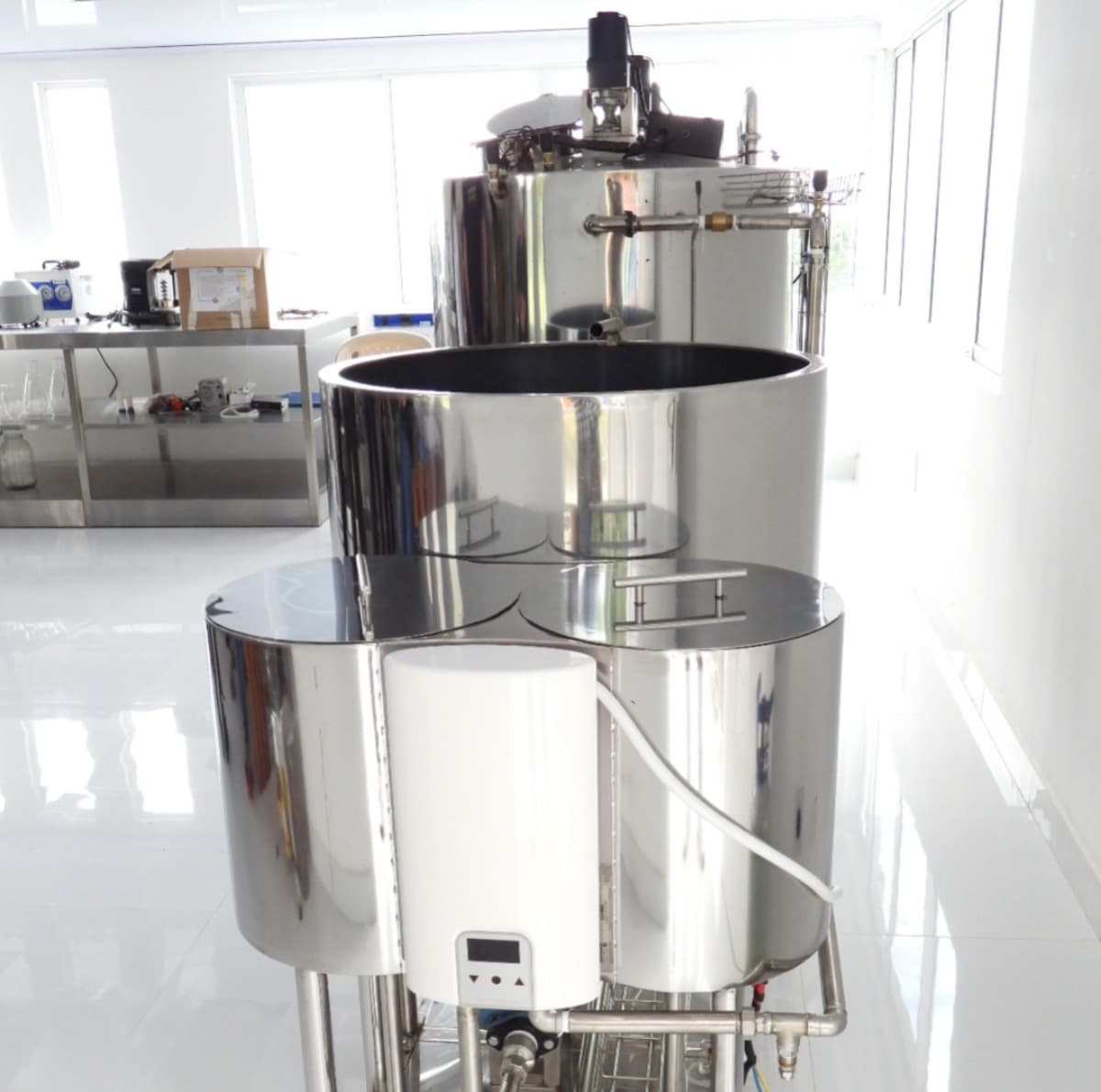 Close-up of coffee cherries and laboratory equipment for fermentation analysis