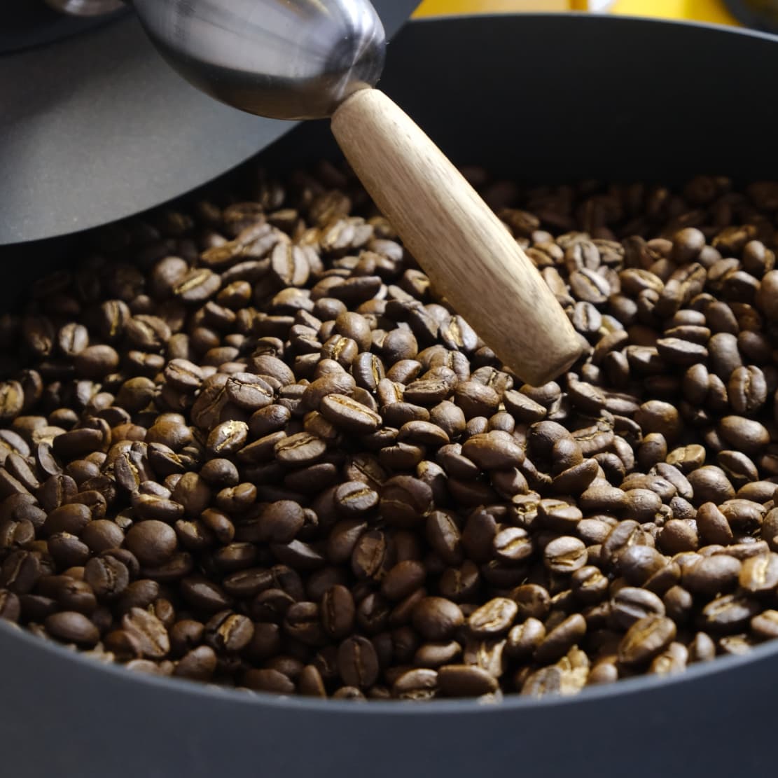 Coffee beans being roasted in a specialty coffee roaster machine