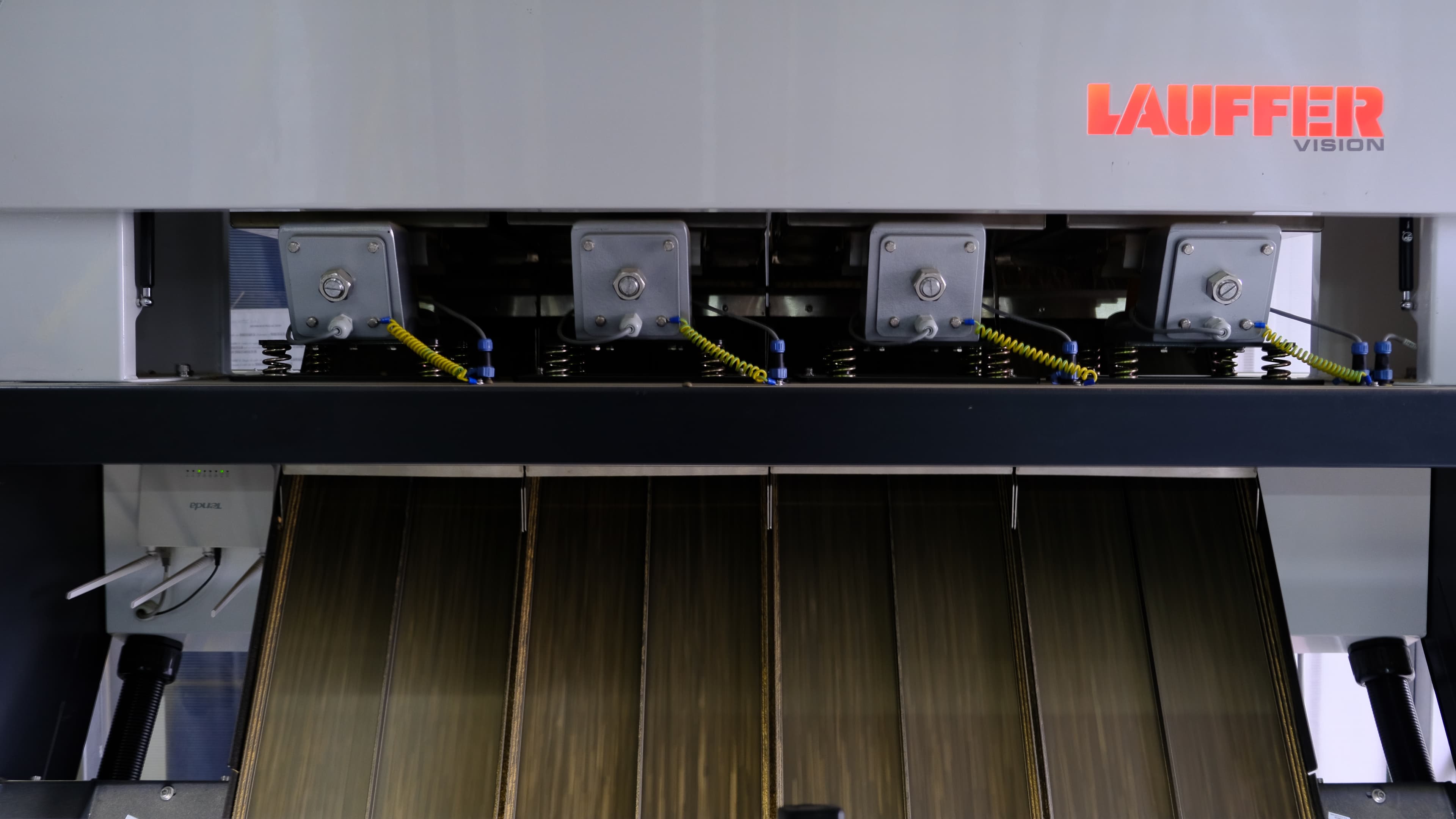 Coffee beans being processed in a hulling machine at Finca El Paraíso